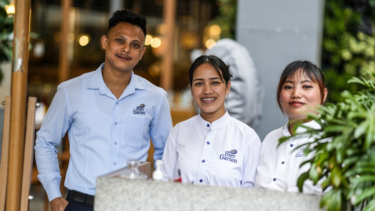 Restaurant team standing together in uniform