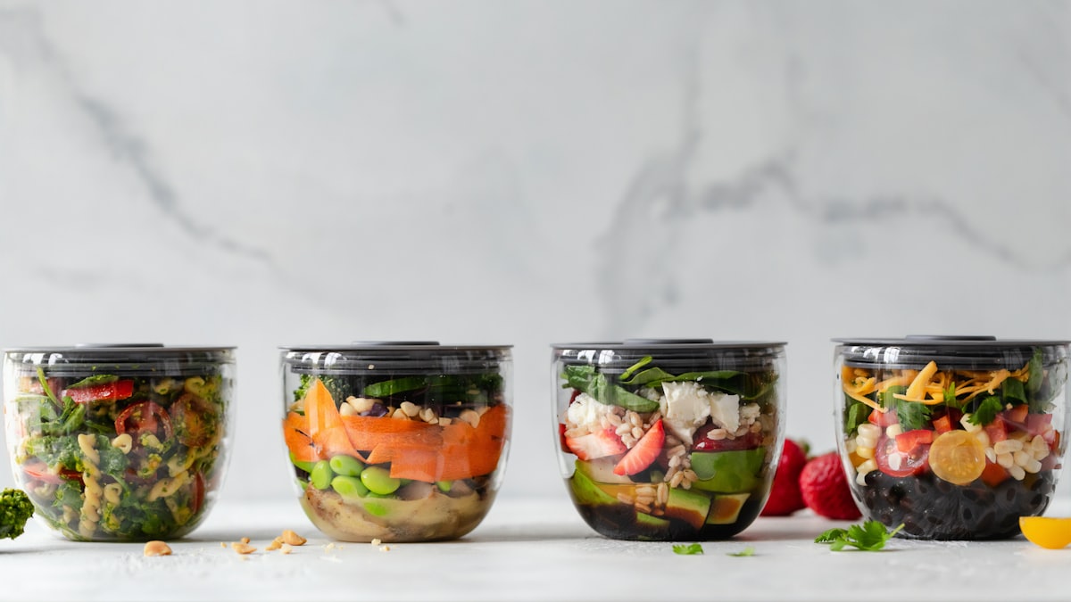 Chef arranging mise en place containers before service