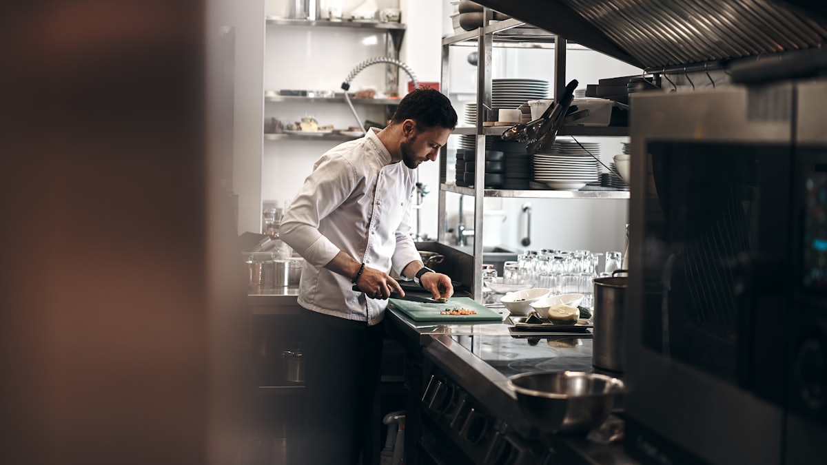 Restaurant team working together in an open kitchen