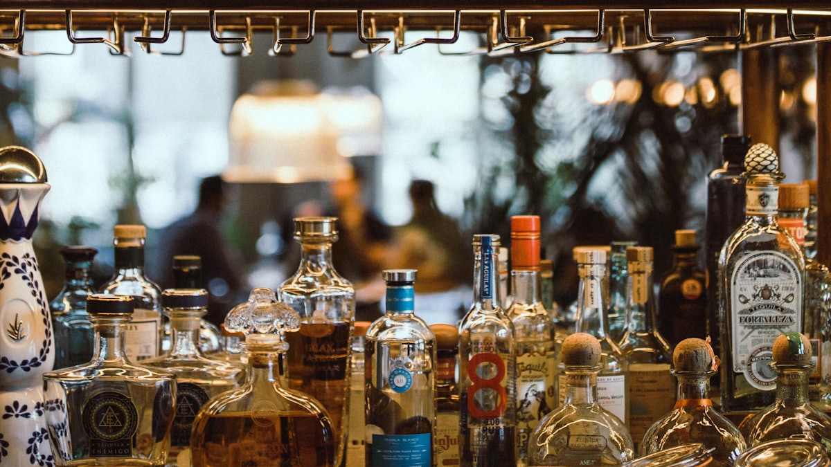 Well-stocked bar with bottles behind the counter