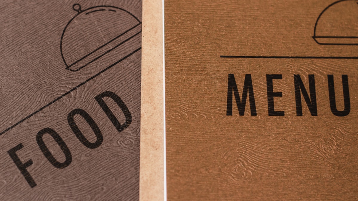 Close-up of a restaurant menu showing dish prices