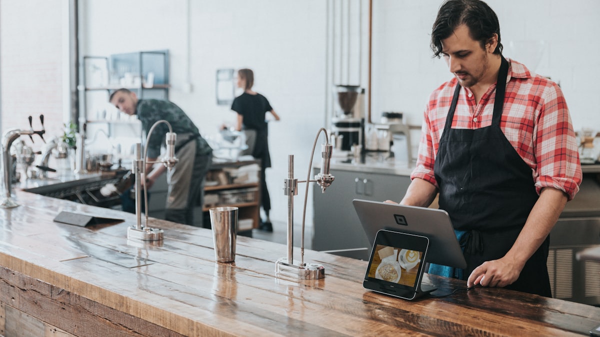 Guest earning loyalty rewards at a café counter