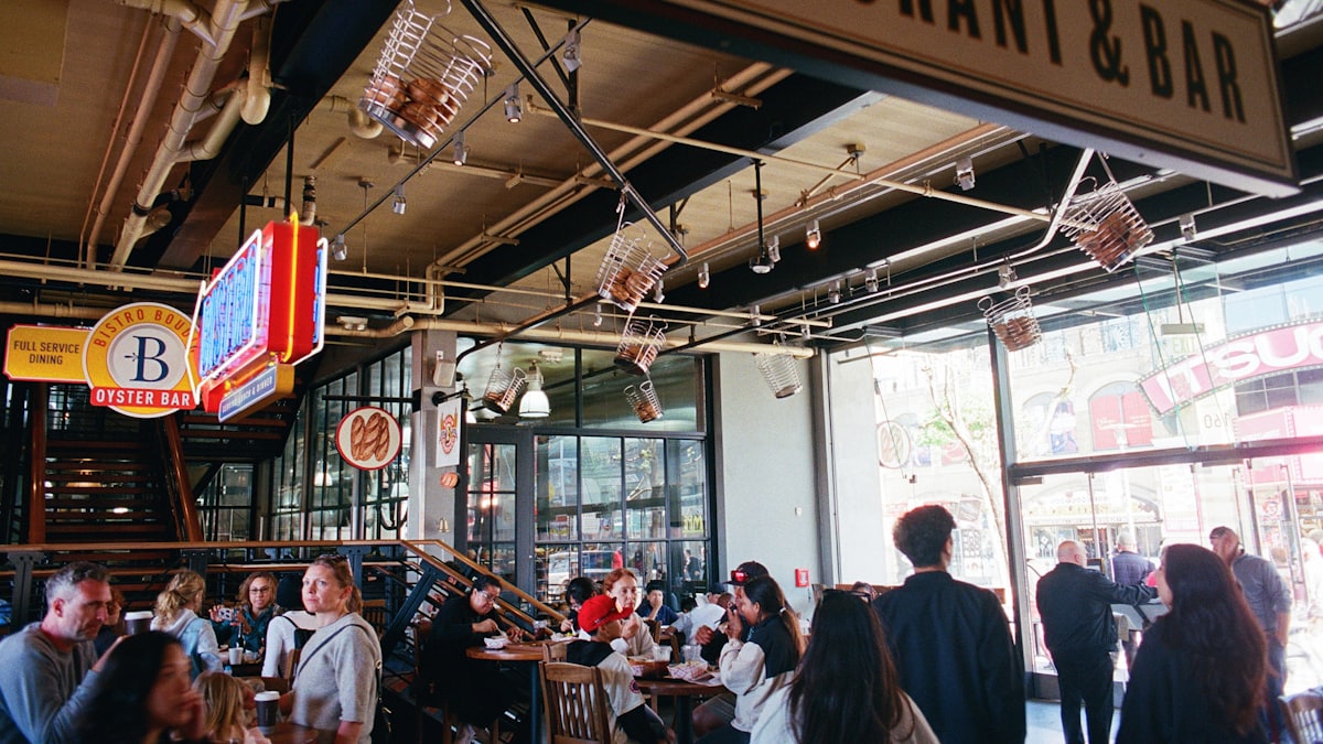 Busy restaurant dining room with guests seated at tables