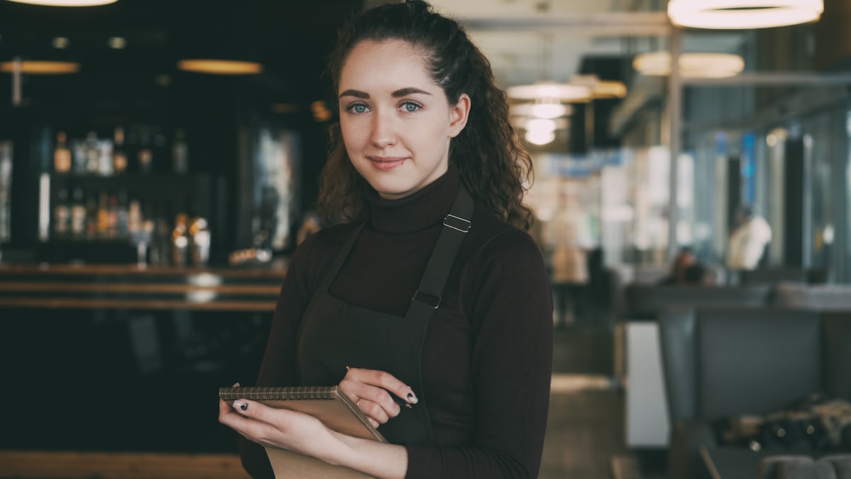 Restaurant servers coordinating during a busy service